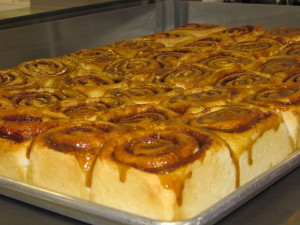 Caramel Cinnamon Buns, fresh out of the oven and smothered with our home made caramel sauce.  